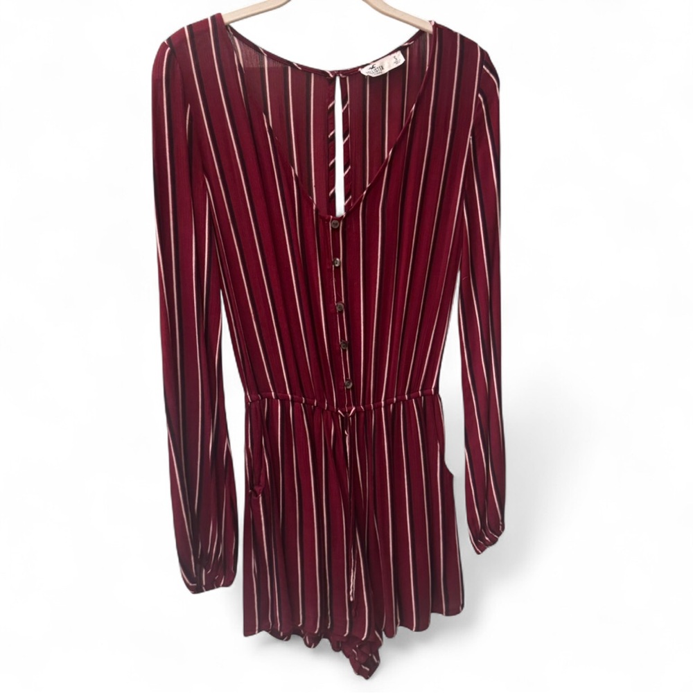Burgundy striped romper with long sleeves and button-up front